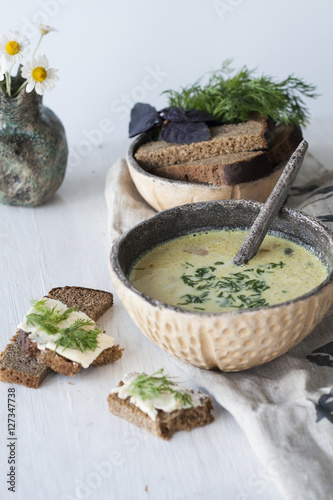 Cheese soup with mushrooms and vegetables, brown bread 