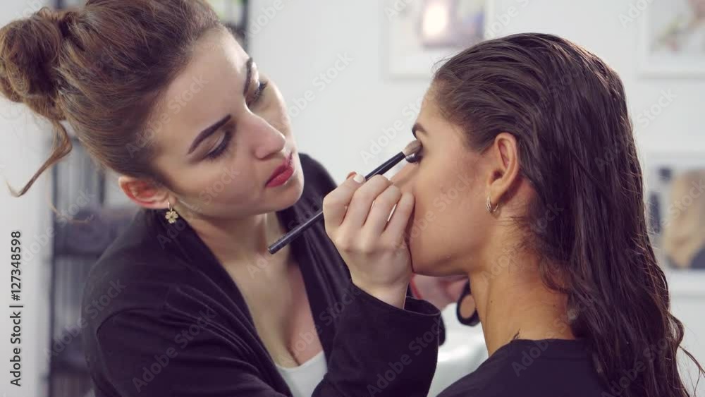Makeup artist doing models makeup. Makeup artist doing models makeup.
