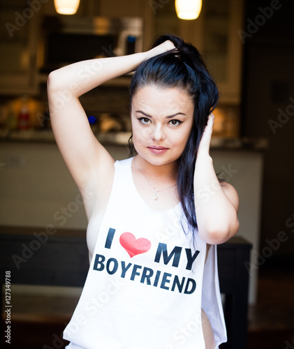 beautiful young woman smiling and exressing love to her boyfriend photo