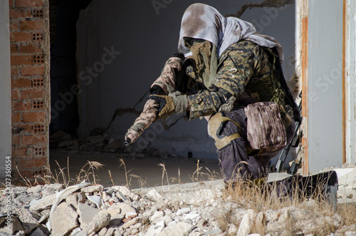 Sniper aim target with scope kneeling position  © John Vlahidis