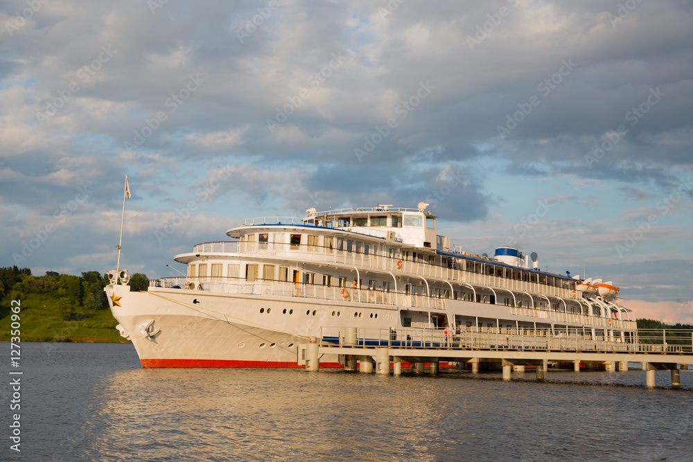 Cruise river ship at the pier on river Volga, Russia