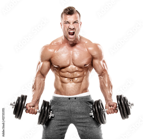 Muscular bodybuilder guy doing exercises with dumbbell