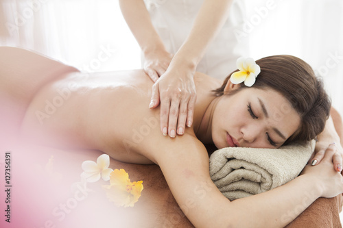 A beautiful woman is receiving a massage