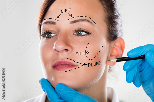 Bilde på lerret Woman With Perforation Lines Marked On Face