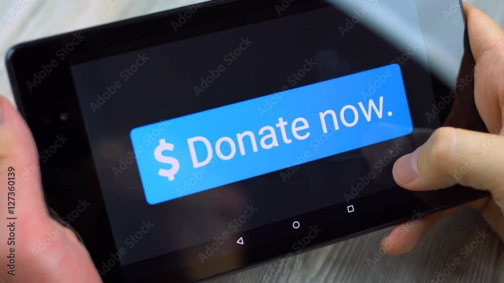 Big Blue download button shown on a tablet screen, man holding the device and pressing the button