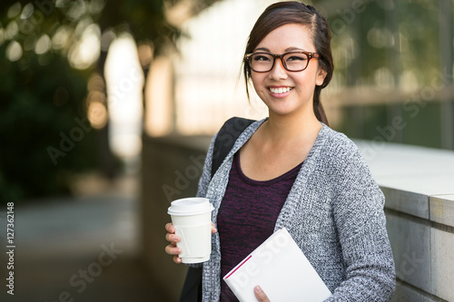 Quadro su tela Smart intelligent grad student glasses confident happy at university hall walkin