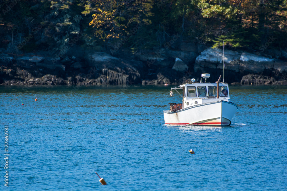 Φωτογραφία Lobster fishing boat in autumn against deep blue ocean water in coastal Maine, N