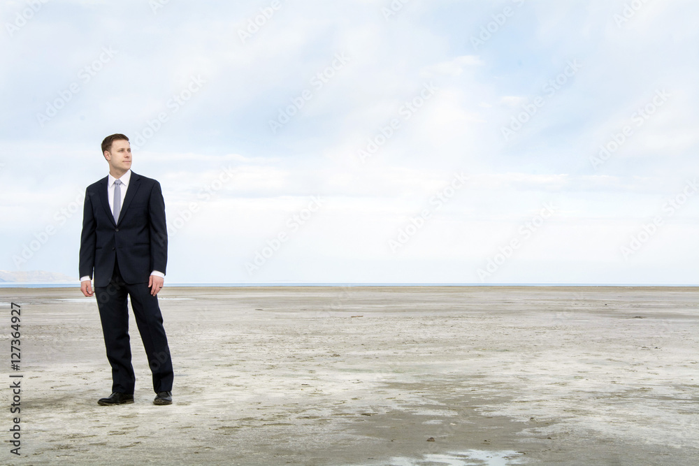 business man looking out over the bonniville salt flats business man looking out over the bonniville salt flats