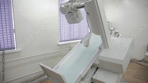 Remote controlled X-ray machine isolated. Radiographic and fluoroscopic diagnostic system with rotating table