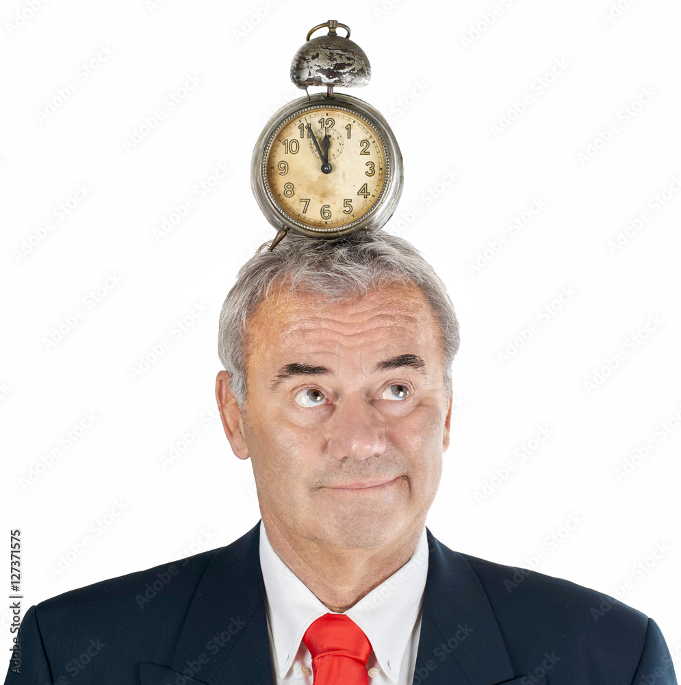 Zeitdruck und Überstunden im Büro, Mann mit Wecker