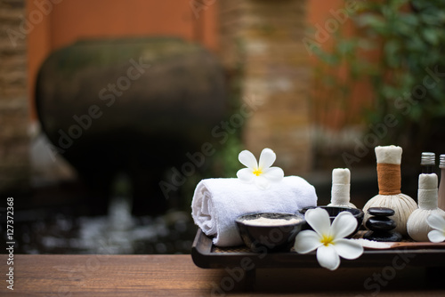 Spa massage compress balls, herbal ball on the wooden with treaments spa , Thailand, select focus