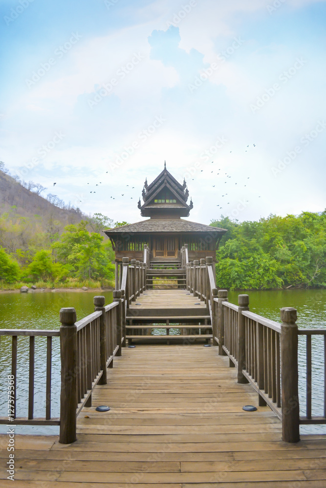 Wooden Thai pavilion with mountain and blue sky, Thailand. Wooden Thai pavilion with mountain and blue sky, Thailand.