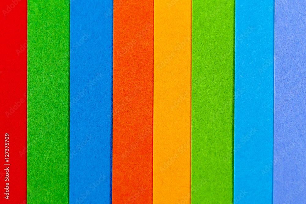 Background of colorful paper parallel vertical stripes Background of colorful paper parallel vertical stripes