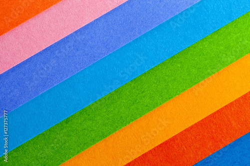 Background of colorful paper parallel diagonal stripes