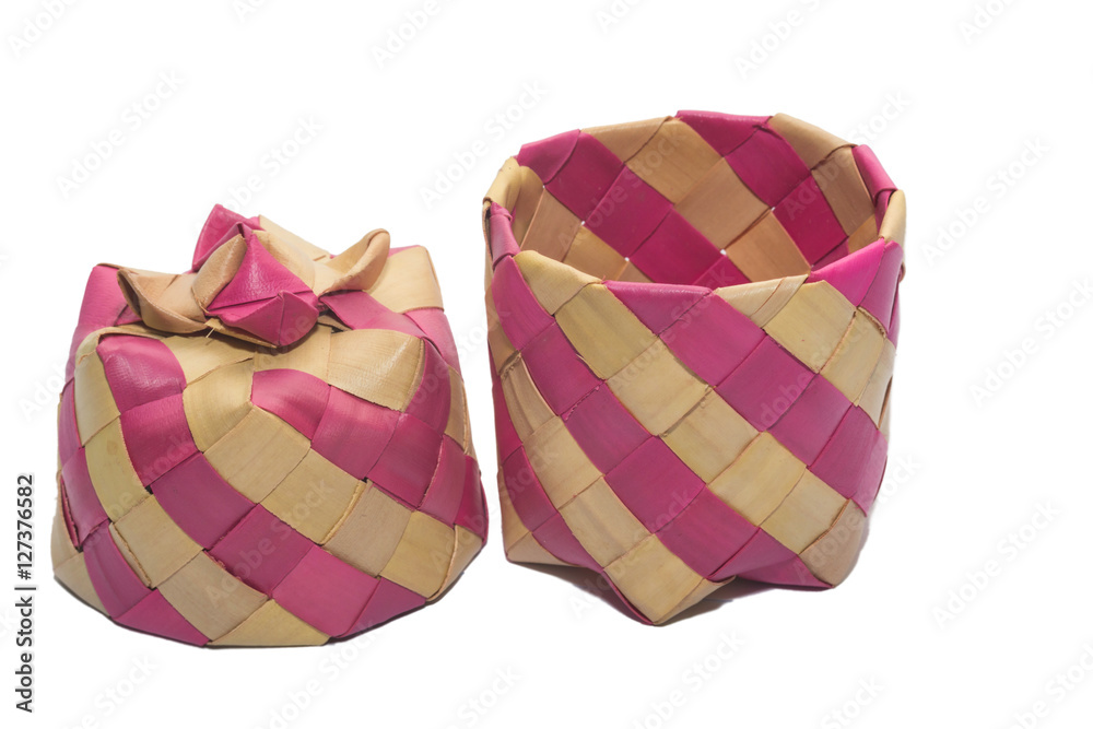 basket weave pattern with palm leaves for the sticky rice steamed inside
basket weave pattern with palm leaves for the sticky rice steamed inside
