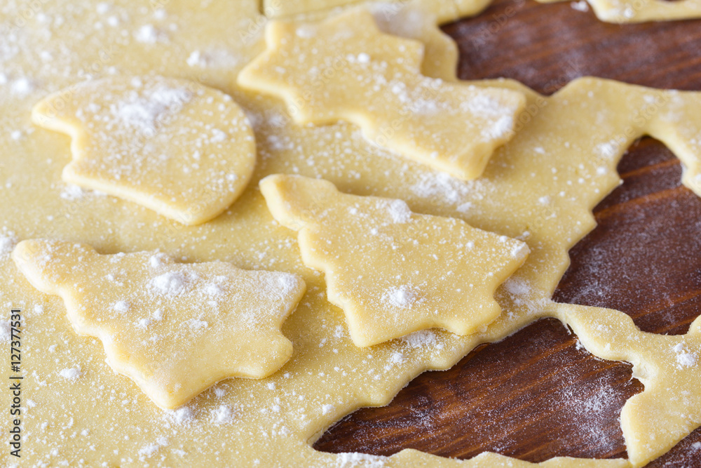 Christmas cookie dough, cookie cutters, spices and nuts
