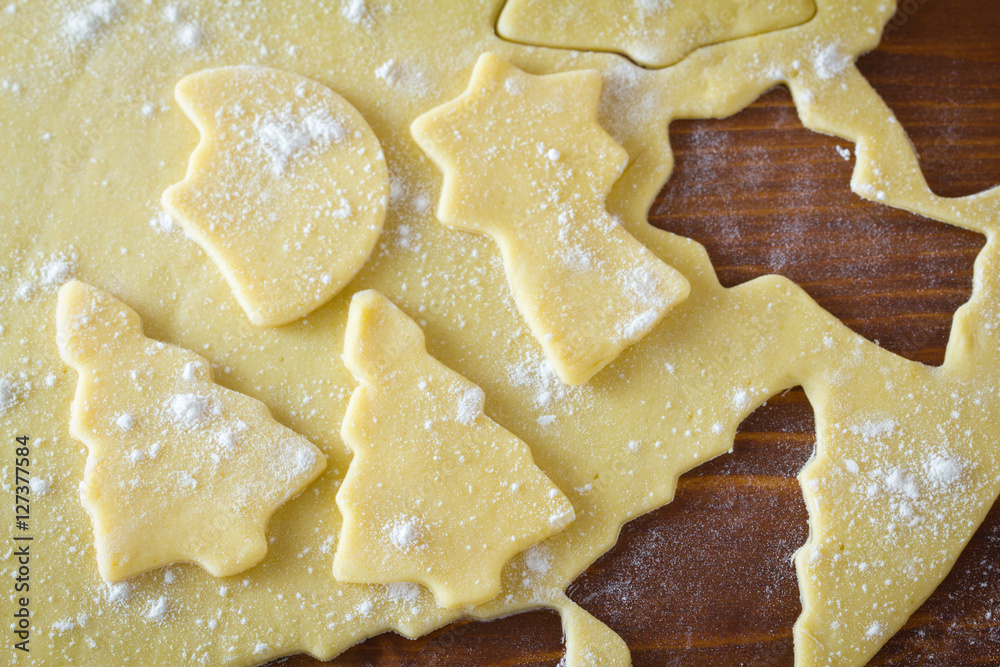 Christmas cookie dough, cookie cutters, spices and nuts Christmas cookie dough, cookie cutters, spices and nuts
