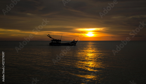 Silhouette of a Boat at Sunset