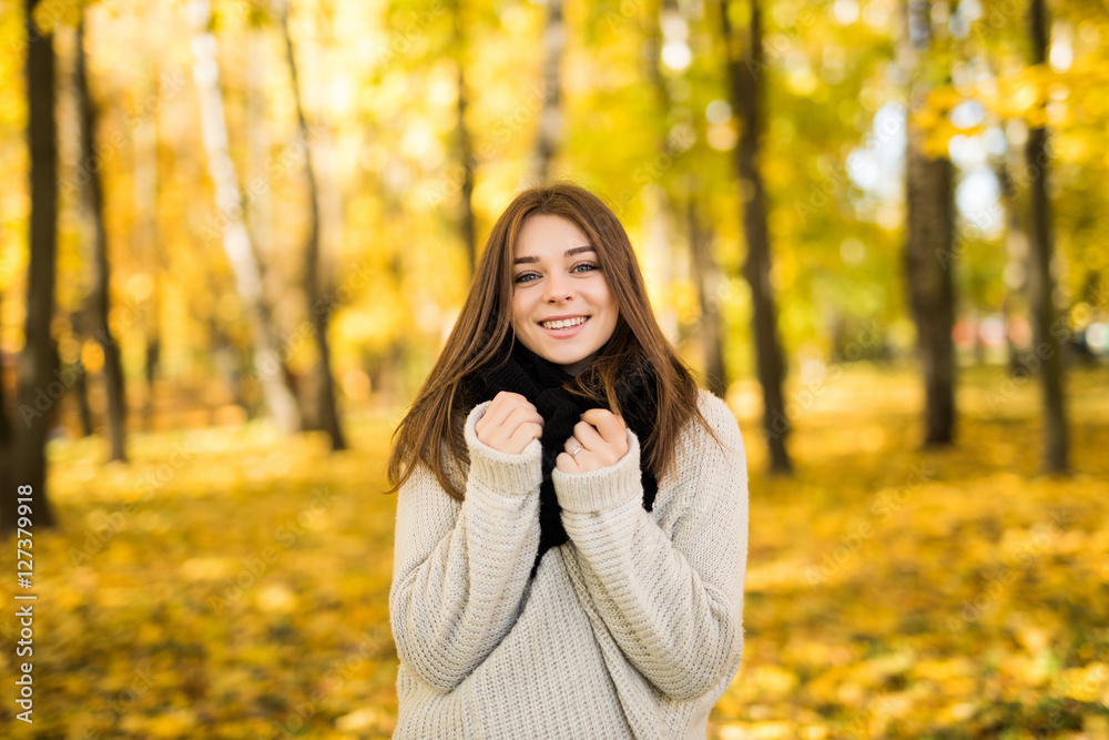 Portrait of young girl in sunny autumn park Portrait of young girl in sunny autumn park
