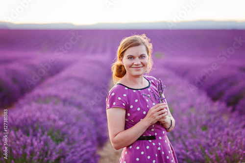 Romantic woman in lavender fields, having vacations in Provence,