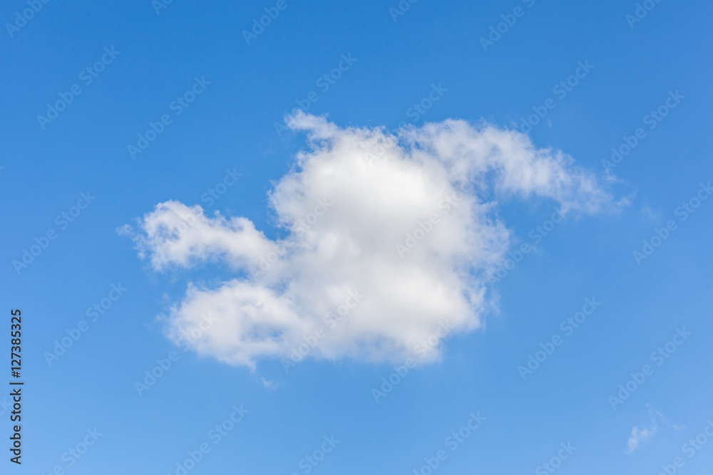 White fluffy clouds over the blue sky background. White fluffy clouds over the blue sky background.
