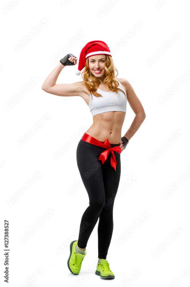 Santa hat Christmas woman tied with red bow showing biceps. Santa hat Christmas woman tied with red bow showing biceps.