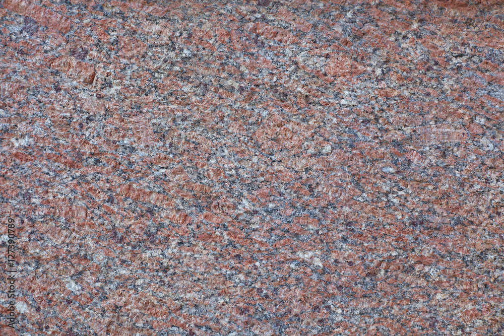Red granite slab closeup may be used as background Red granite slab closeup may be used as background