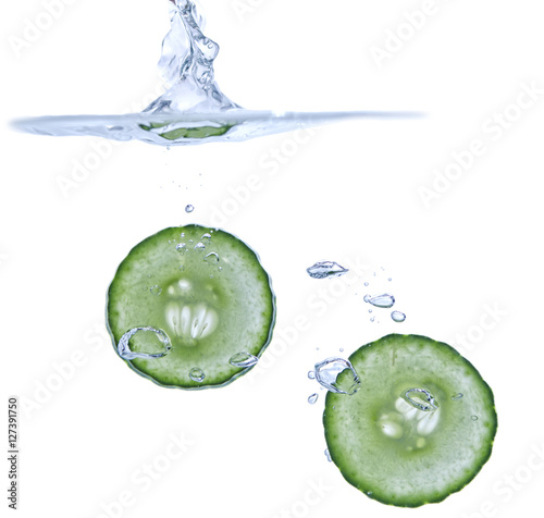 Isolated Slices of Cucumber in Water