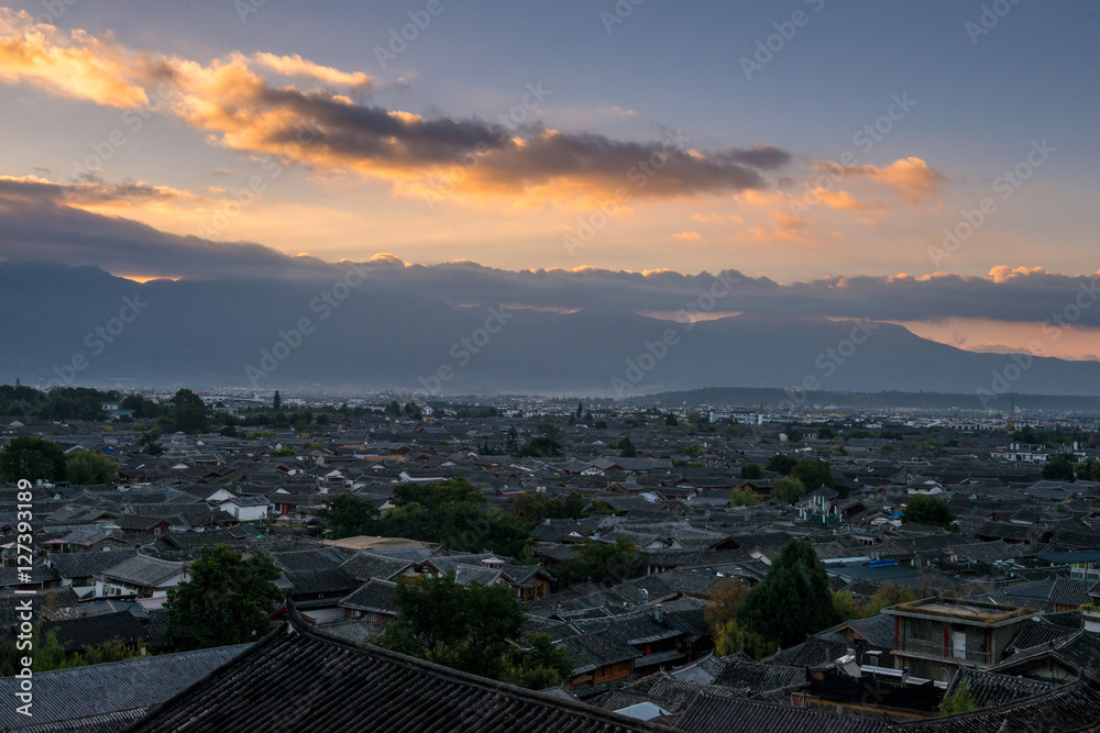 Fototapeta premium Top View of traditional roof with sunrise and dramatic effects at The Old Town of Lijiang is a UNESCO World Heritage Site located in Lijiang City, Yunnan, China.