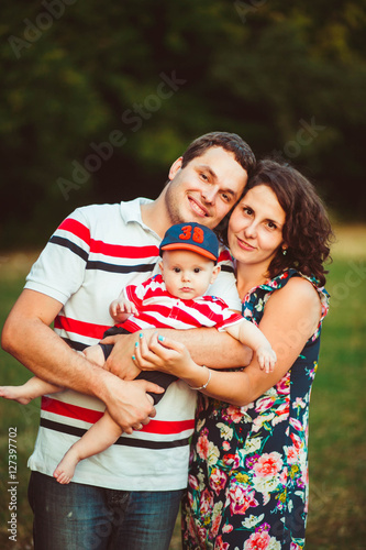 wonderful portrait of beautiful and happy parents with their cut