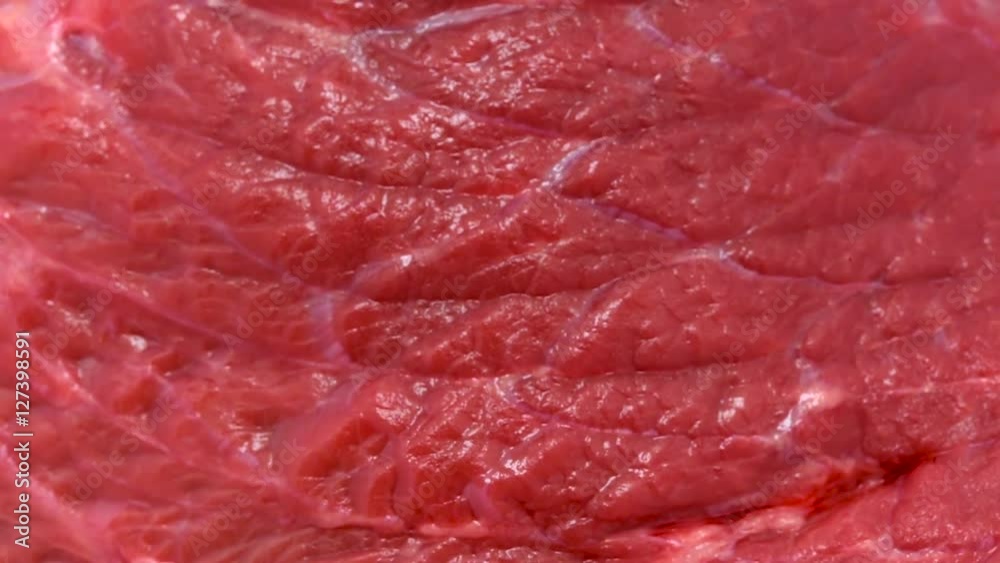 Rotating beef meat at white isolated background Rotating beef meat at white isolated background