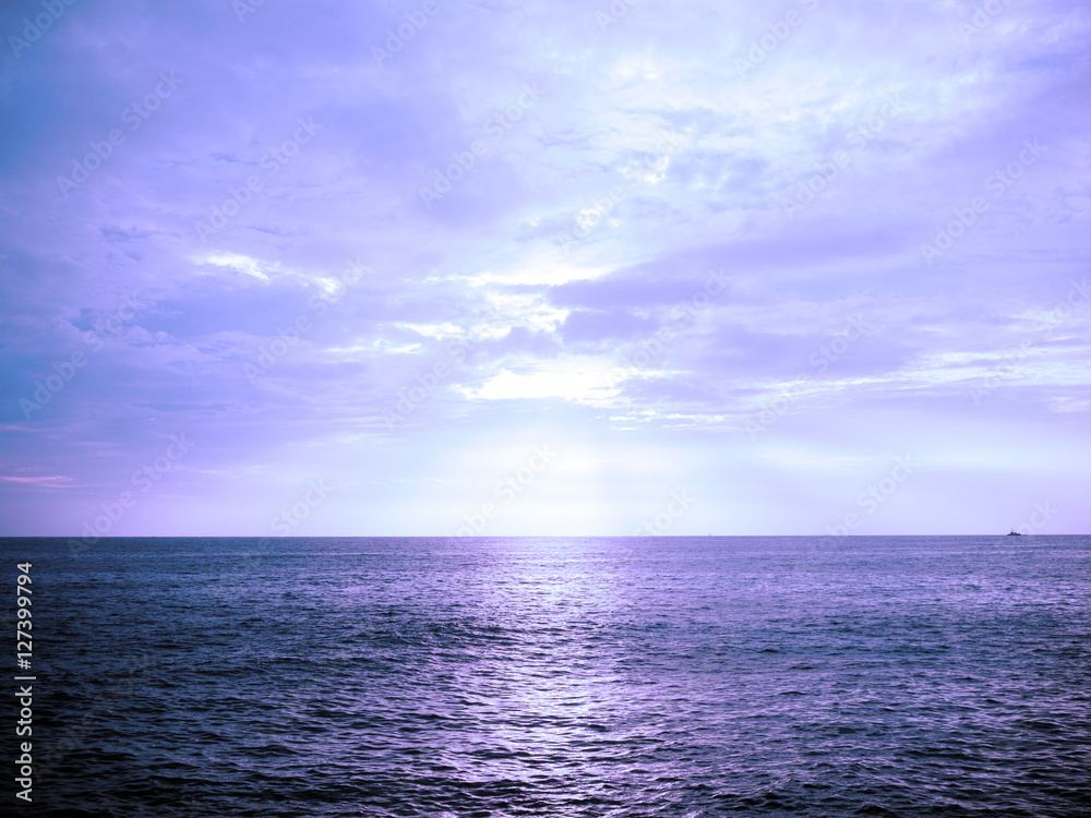 Ocean at sunset with blue filter effected