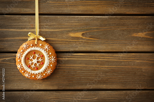 Delicious Christmas cookie on wooden background