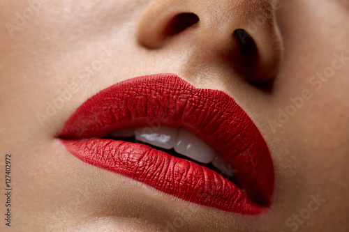 Closeup Beautiful Woman Lips With Red Lipstick On. Beauty Makeup