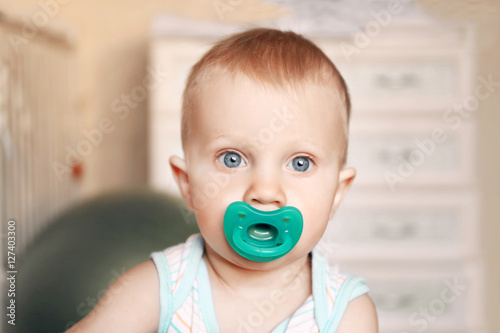 Cute little boy with dummy ...