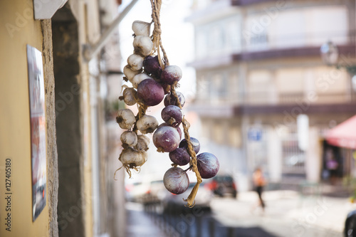 Portugal, drying garlic braid photo