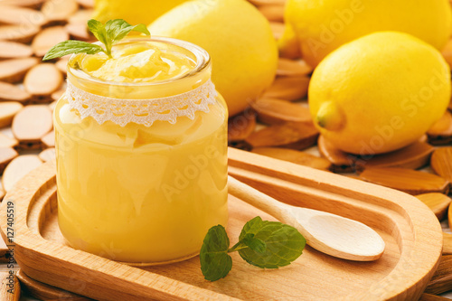 Lemon curd (english citrus cream) in glass jars