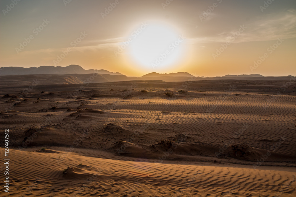 Fototapeta premium Sunset over the Wahiba Sands desert, Oman.