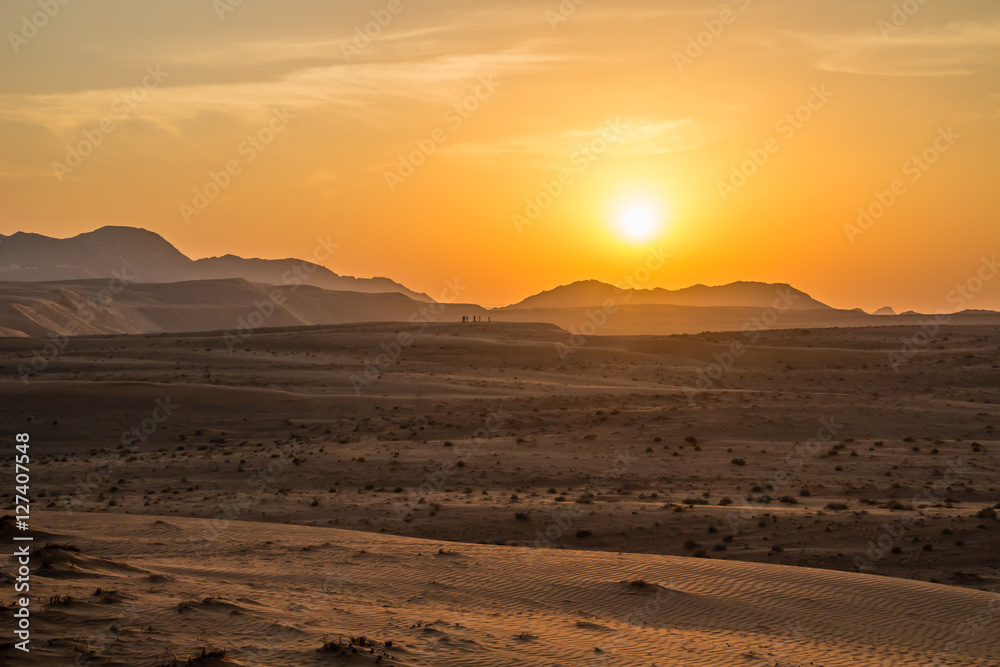 Sunset over the Wahiba Sands desert, Oman.