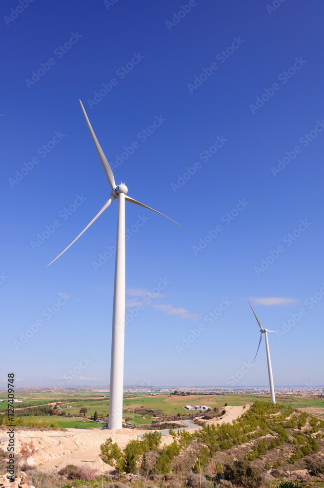 Huge windmill station with blue sky background Huge windmill station with blue sky background