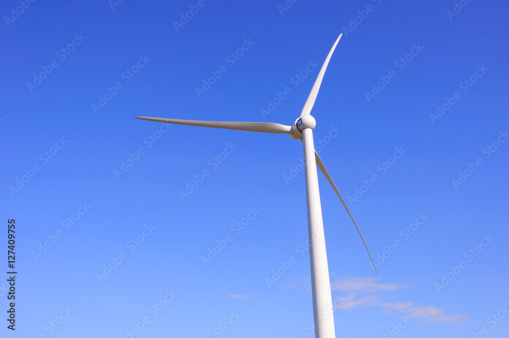 Huge windmill station with blue sky background