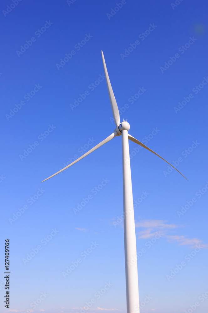 Huge windmil station with blue sky background Huge windmil station with blue sky background