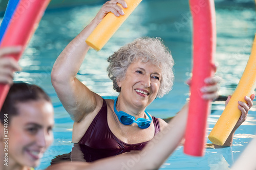 Senior woman doing aqua aerobic