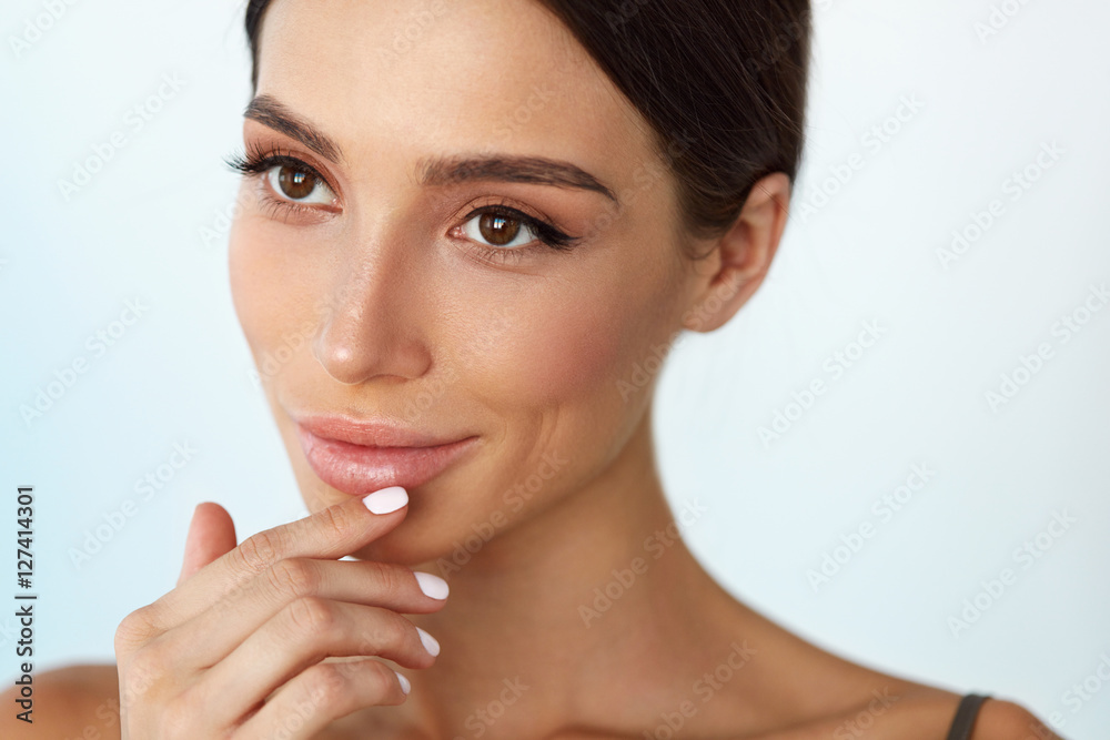 Lips Skin Care. Woman With Beauty Face Applying Lip Balm On Lips Skin Care. Woman With Beauty Face Applying Lip Balm On