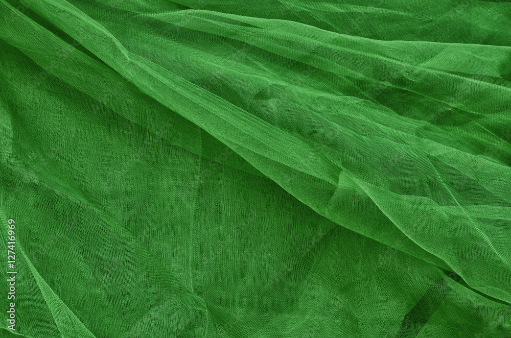 Close-up of plastic net. Artistic texture or background. Abstract plastic net texture. Background in dark green. Close-up of plastic net. Artistic texture or background. Abstract plastic net texture. Background in dark green.