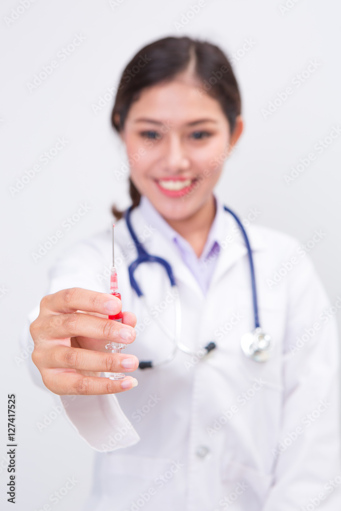 Woman doctor with syringe on white background Woman doctor with syringe on white background