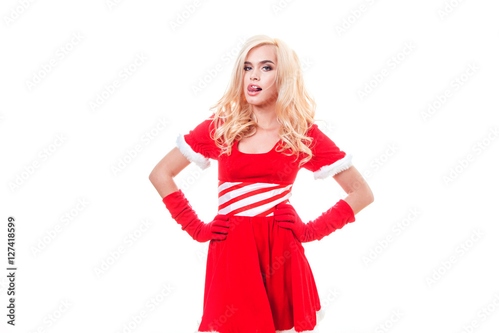 Beautiful blonde woman in a red New Year's costume standing on the white background Beautiful blonde woman in a red New Year's costume standing on the white background