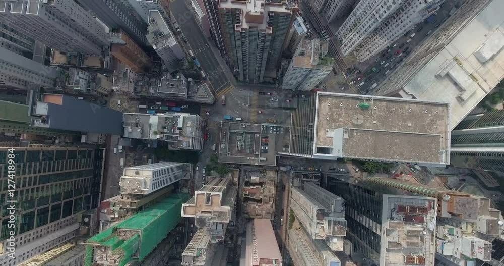 Aerial view of Hong Kong skyline in the day time.Beautiful aerial shot of many high skyscrapers, busy road, city traffic. Top view of downtown.