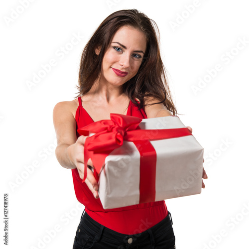Pretty young girl holding a gift