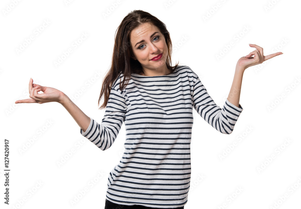 Pretty young girl pointing to the laterals having doubts Pretty young girl pointing to the laterals having doubts